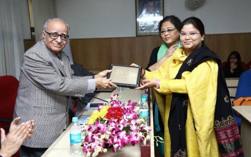 Ms. Hemlata Kheria and Ms. Laldingliani Sailo presenting the momento to Shri T. Chatterjee, Chairman, IIPA